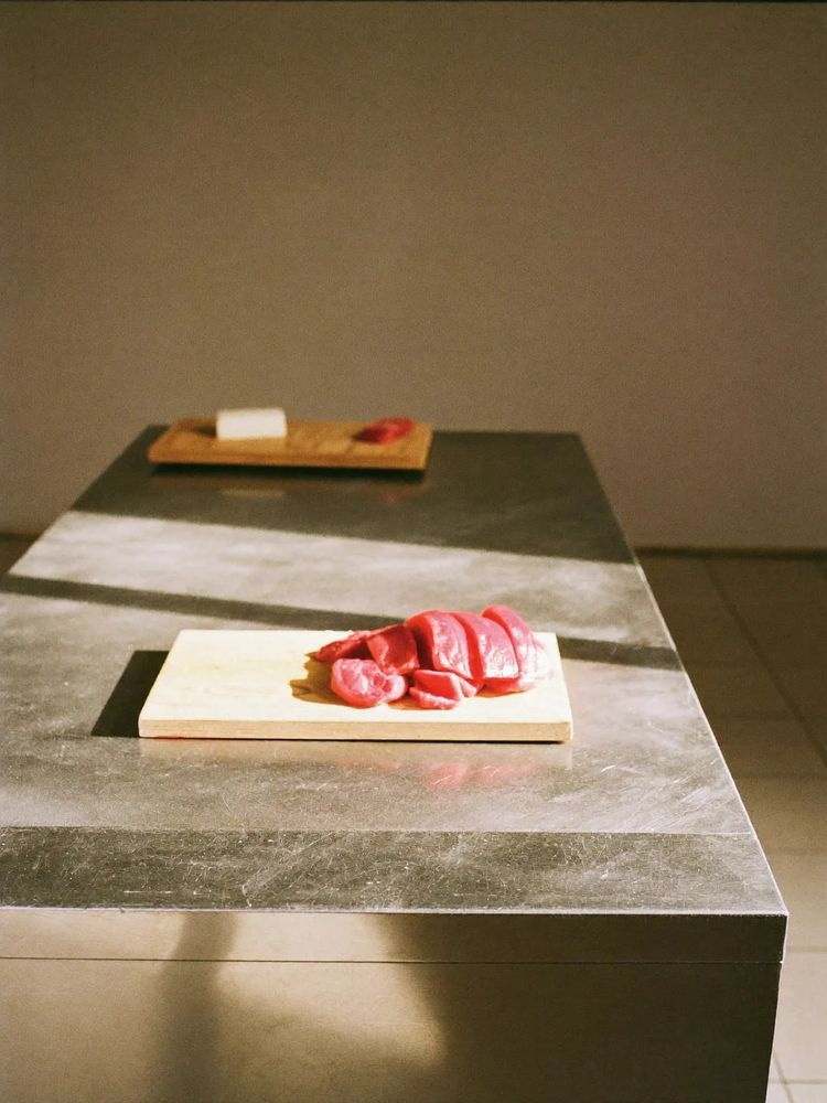 A stainless steel prep bench in the butcher's back room.